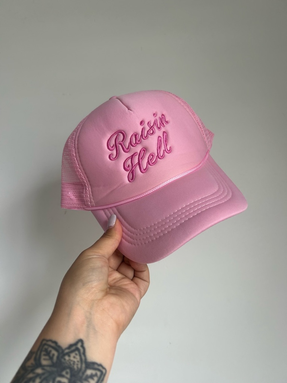 Pink "Raisin Hell" Script Trucker Hat
